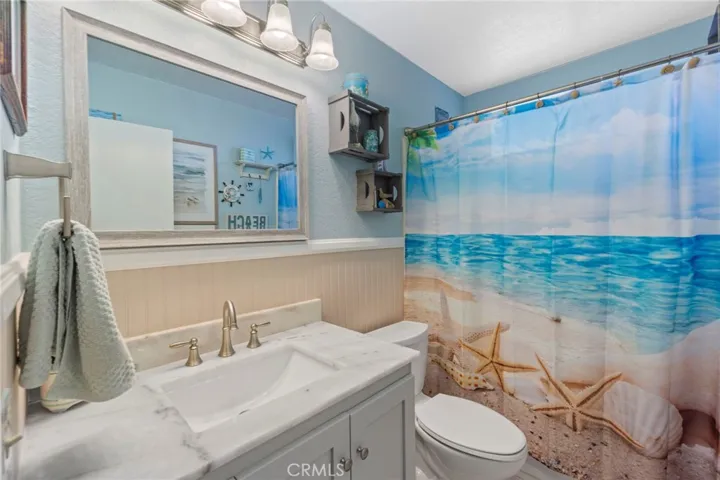 Downstairs full bath, quartz countertops, tub and shower combo
