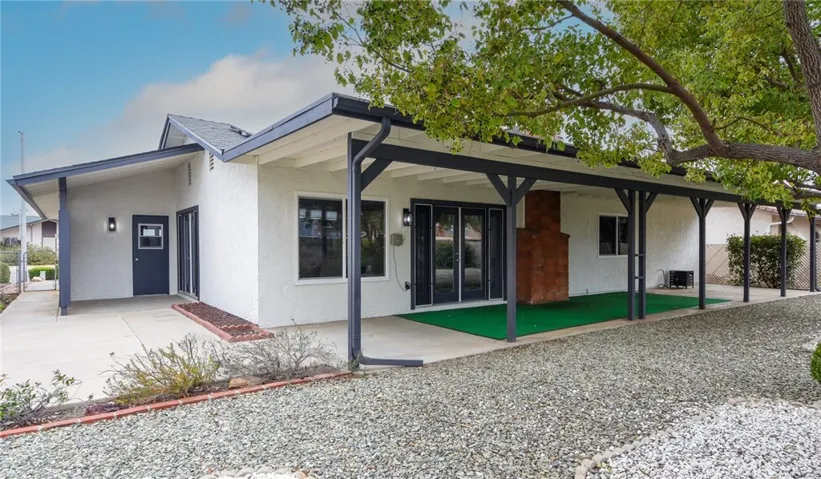 Large Patio cover spans the length of the house