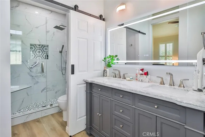 Primary bath w/ barn door to shower