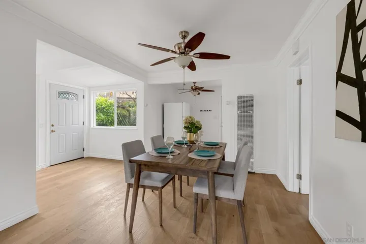 The open living area offers plenty of room for dining and is convenient to the kitchen as well as the living room.