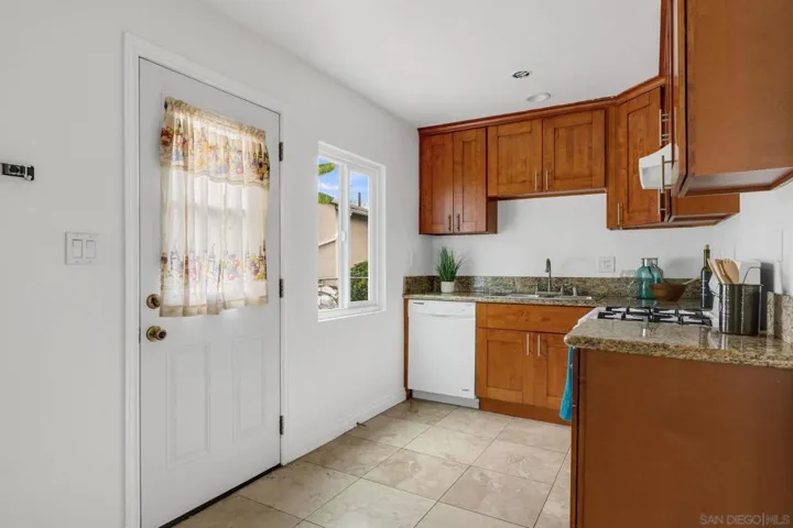 That door leads to a small grilling area as well as the access to the laundry room entrance.