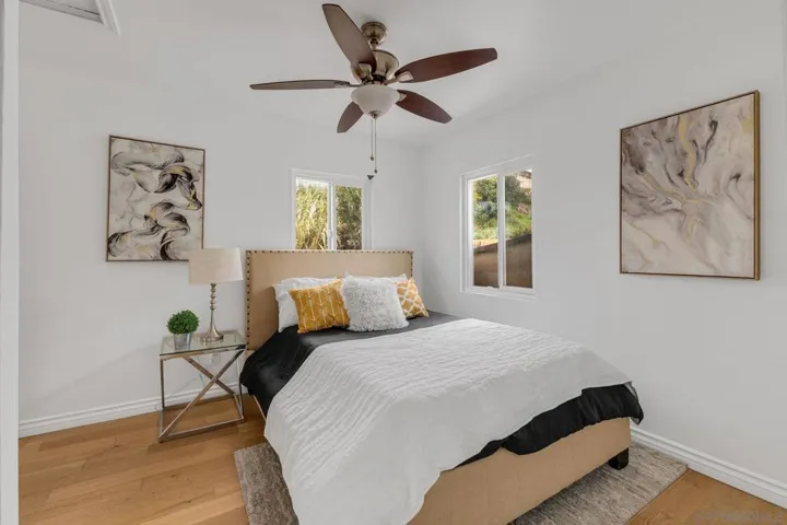 Every room in the home has a ceiling fan and the original hardwood flooring.