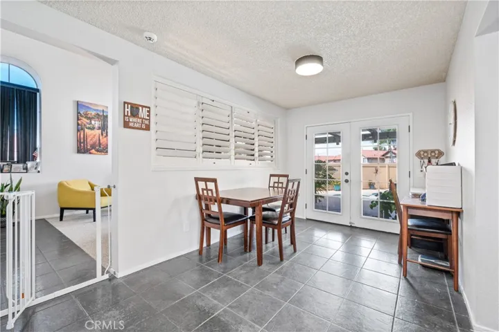 Dining room w/ exit to backyard patio and pool