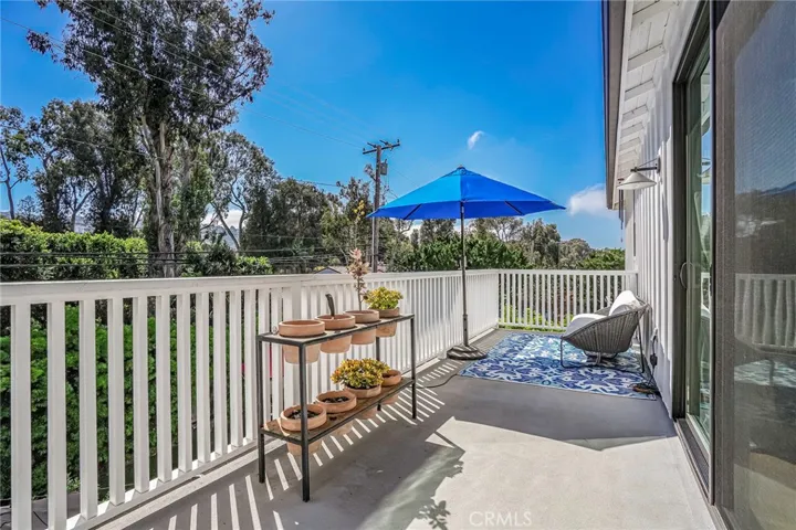 Sunny south facing balcony off of the master bedroom, overlooking the backyard.
