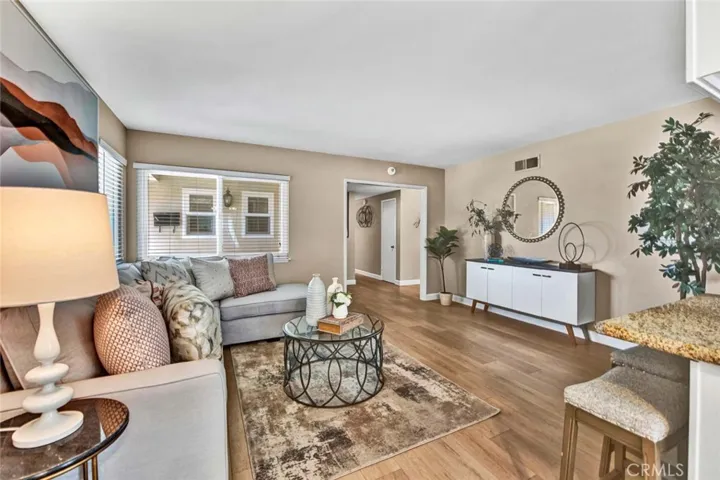 Warm and Inviting Family Room which is Open to a Sunlit Granite Kitchen