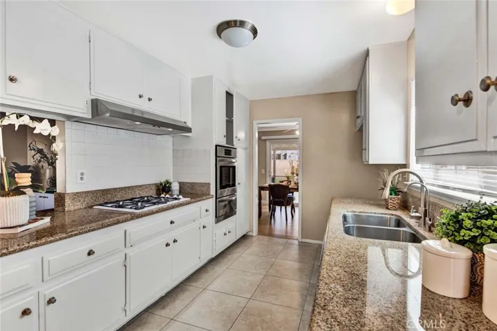 Granite Countertops, White Subway Tile Backsplash, Stainless Sinks, Tile Flooring