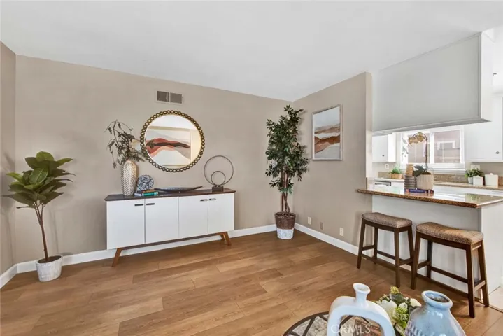 Family Room Open to a Granite Kitchen with Breakfast Bar