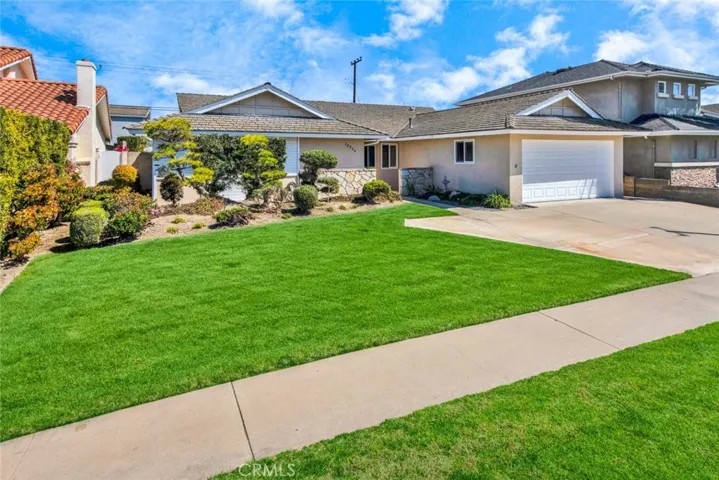 Beautiful Curb Appeal with Perfectly Manicured Professional Landscaping, Lush Front Lawn, Stone Siding
