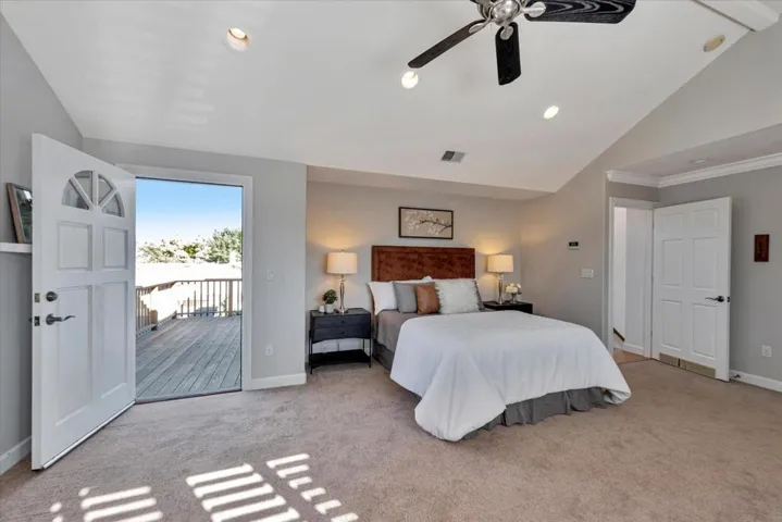 Primary bedroom with access to upstairs balcony