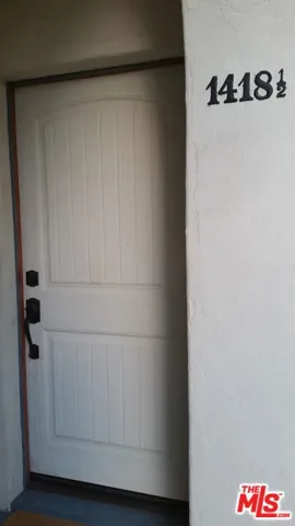 1418 1/2 front door is painted brown now