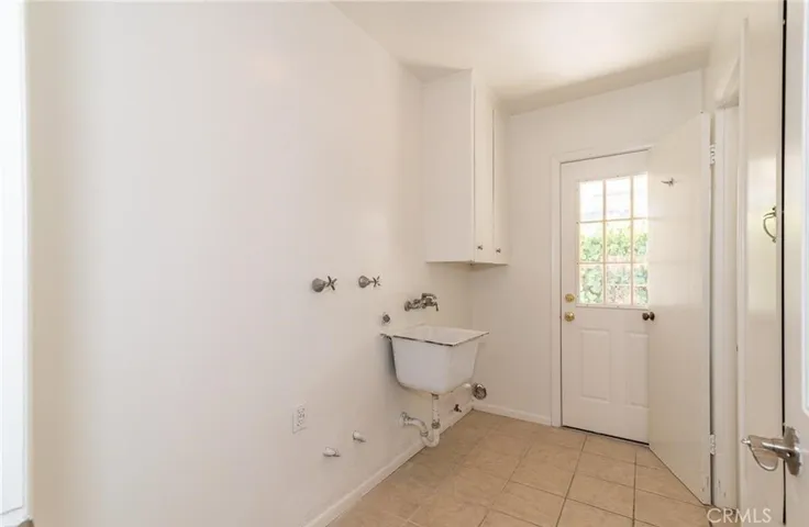 Laundry room on side of home
