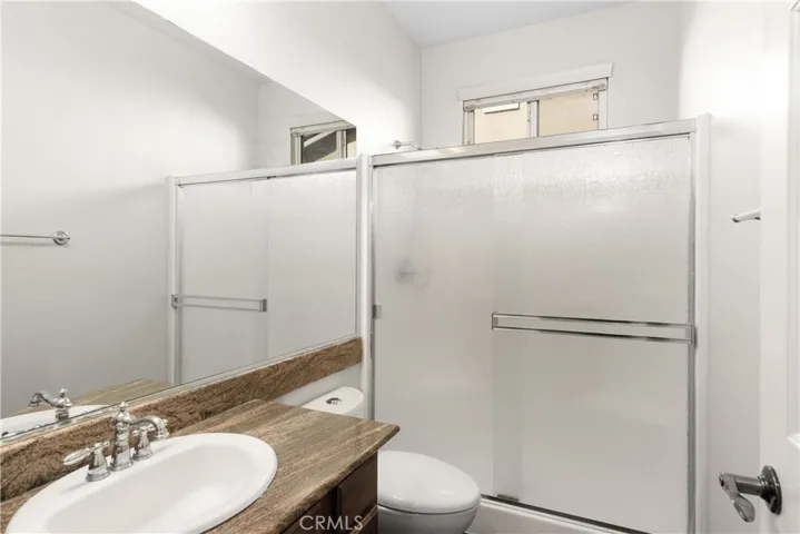 Downstairs bathroom with tub and shower