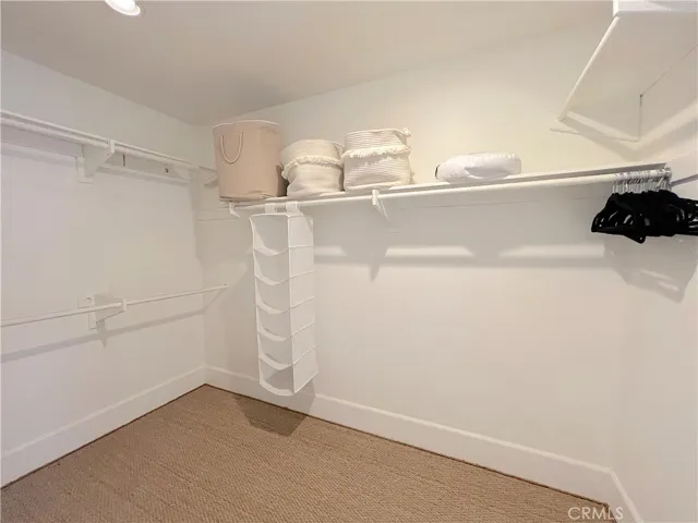 Primary bedroom walk-in closet.
