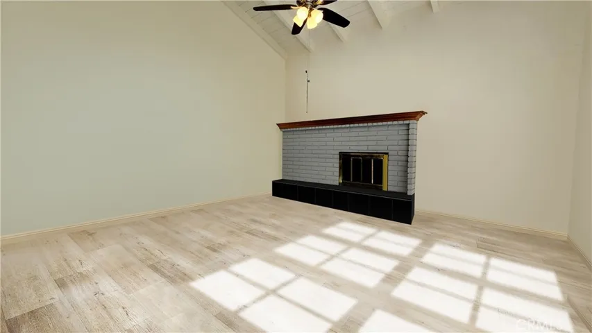 Family Room w Vaulted Ceilings and French Doors to Backyard