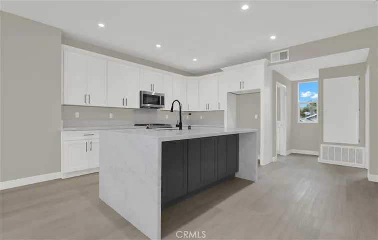 Kitchen with Large Waterfall Island