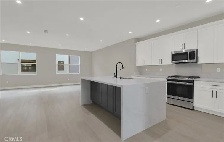 Kitchen with Large Waterfall Island