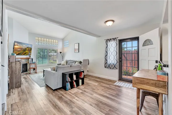 Open, spacious living room with new wood plank flooring