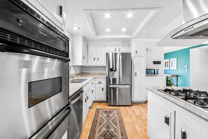 The kitchen has recessed lights