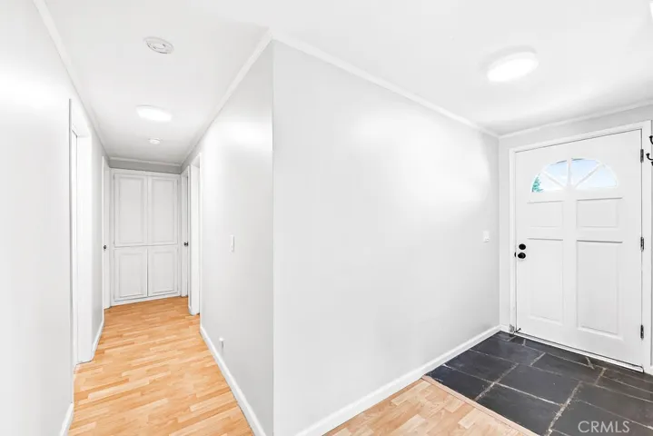 Front entrance gives hallway access to rooms