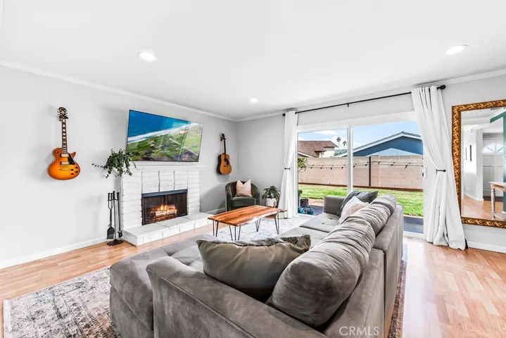 Family room has plenty of natural sunlight from the sliding door