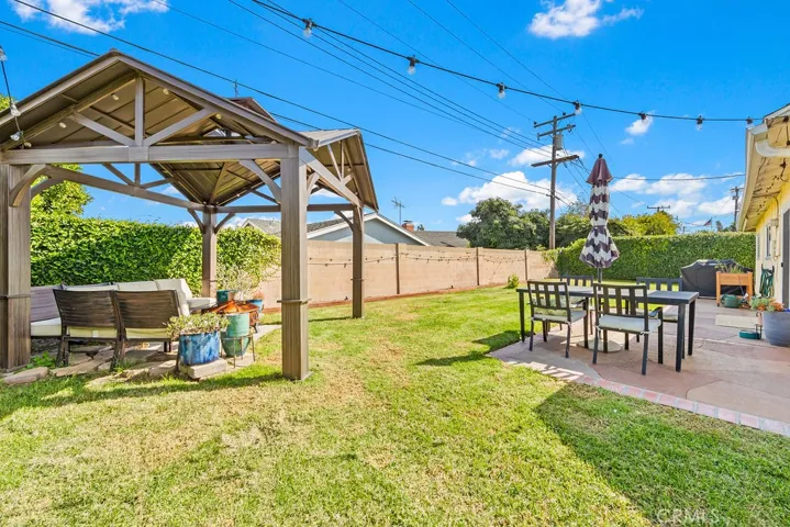 Backyard has a gazebo and patio area for entertainment