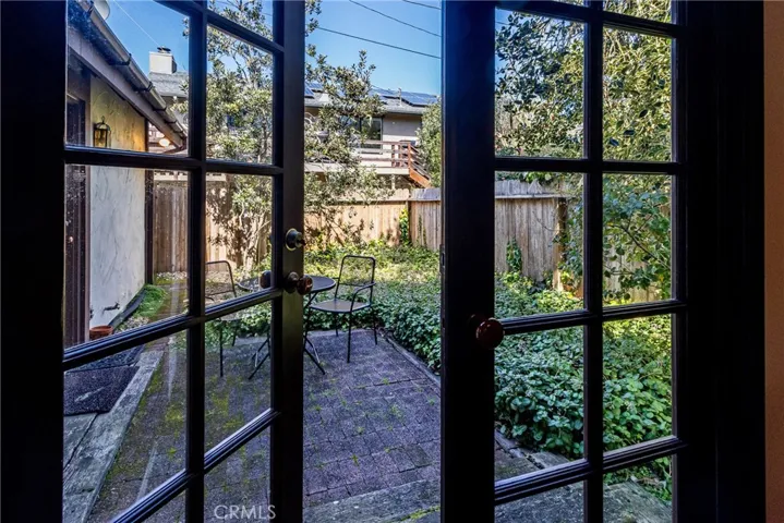 French doors from dining room to back courtyard.