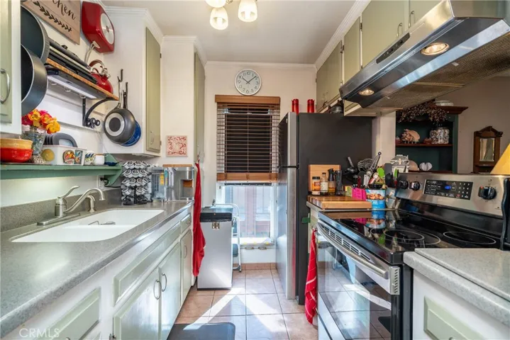 The kitchen has a breakfast countertop and is open to the living area.