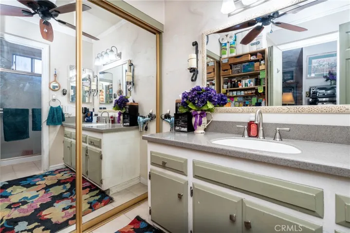 Updated bathroom has a large closet.