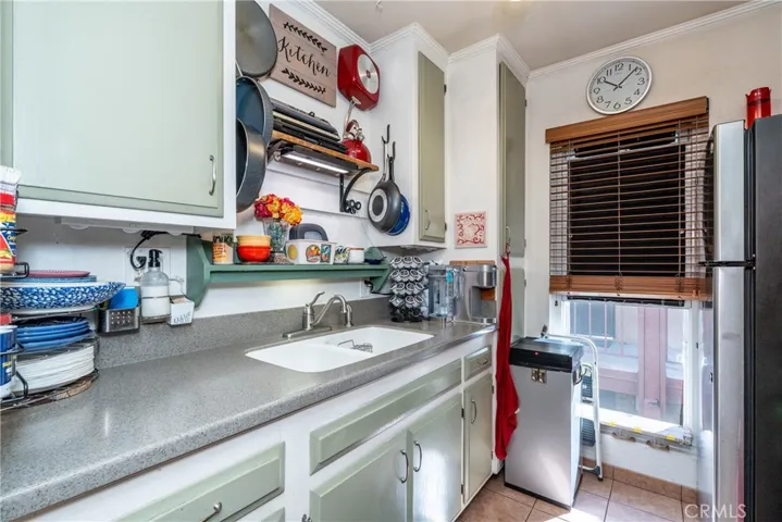 Updated kitchen has lots of storage features and a large newer window.