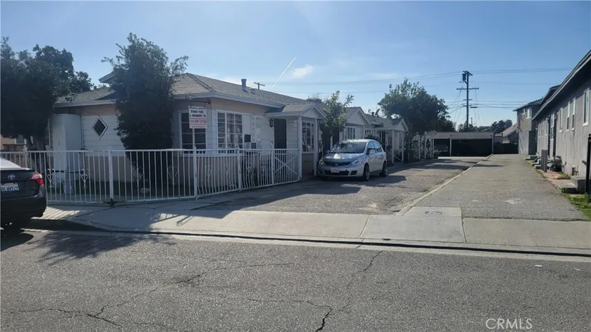 Front view of the subject property from street to the rear parking area