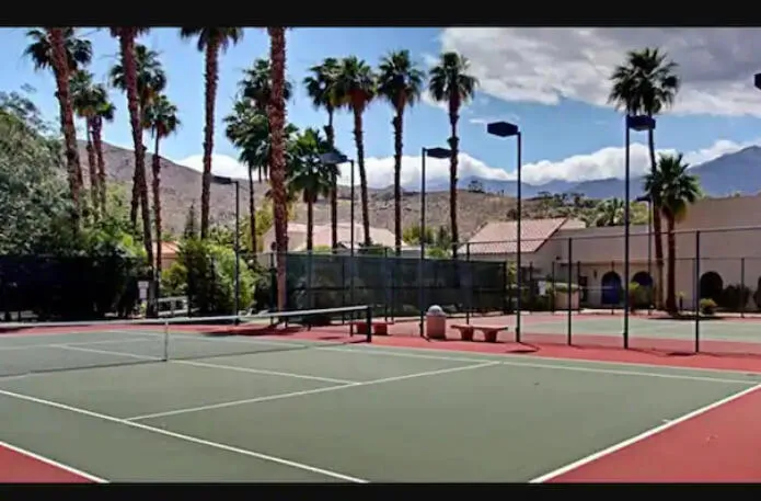 115 one of 4 tennis courts on property