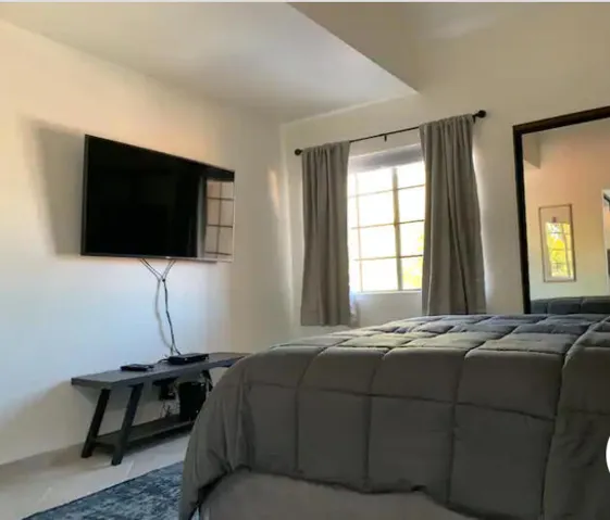 115 first bedroom tv and window