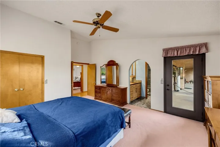 Primary Bedroom with Double Door Entry, Patio Access and en suite Bathroom