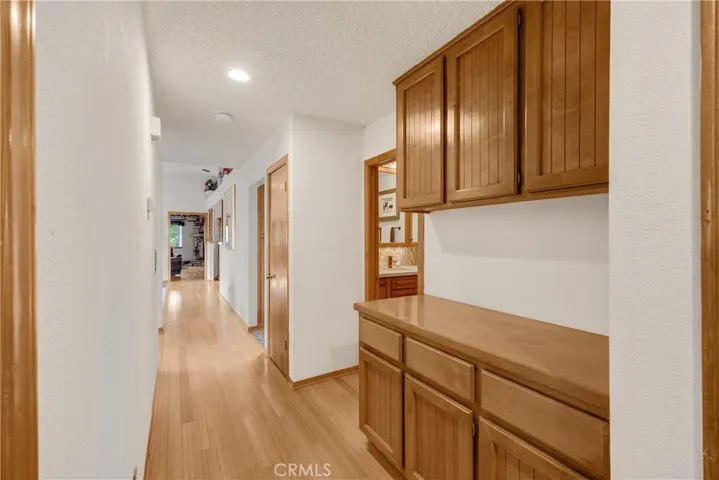 Hallway with Bamboo Flooring & Linen Storage