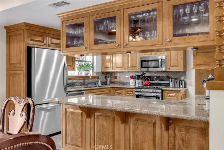 Countertop bar area in Kitchen with lots of cabinetry