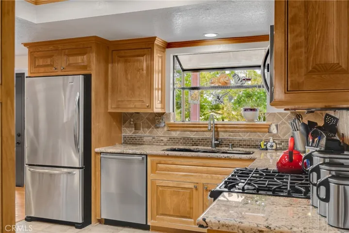 Kitchen Garden Window with view to the Landscaped Backyard