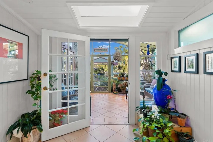 Walk through the kitchen dining area and into a beautiful, indoor patio that leads to the backyard.