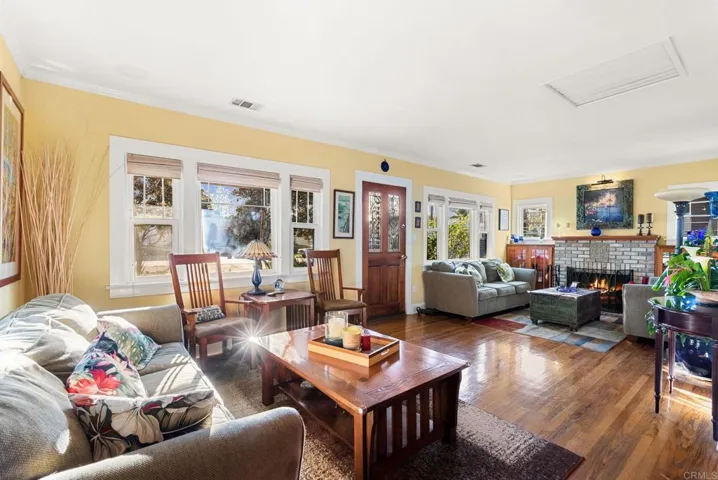Enter into a light, open living room and enjoy your gas AND wood burning fireplace.