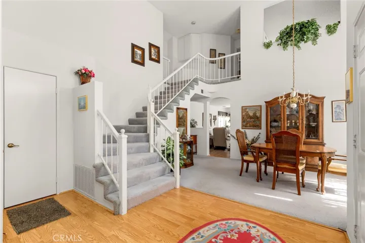 Enter home into the Formal Dining with stairs to 2nd bedroom, 2nd full bathroom and loft