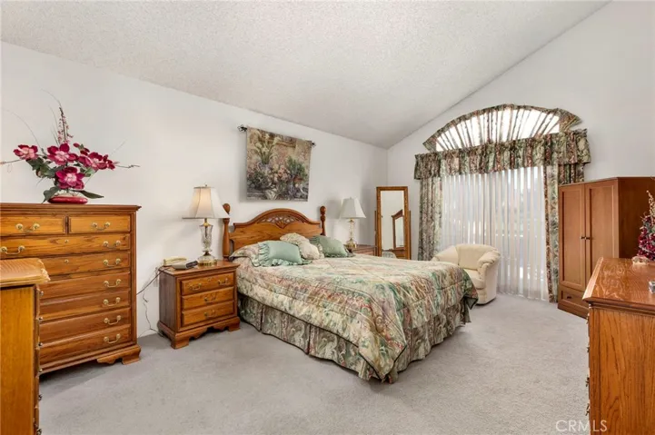 Master bedroom with slider to patio area