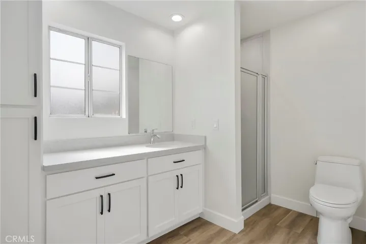 Bathroom located off garage.
