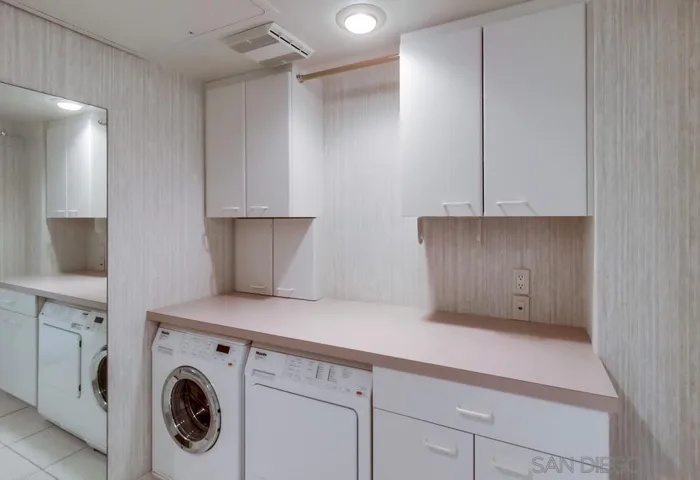 Separate Laundry Room with Full-Size Washer and Dryer