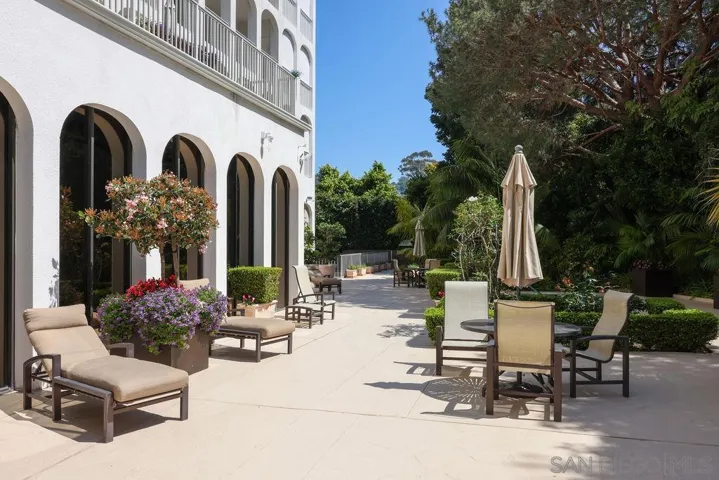 Pool and Spa Area with flowers, plants and lounging areas