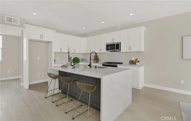 Kitchen with Large Waterfall Island