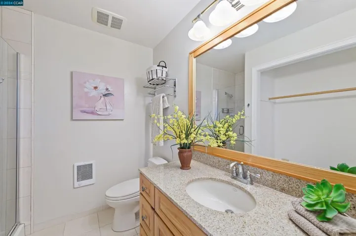 En Suite Bathroom with walk in shower and closet