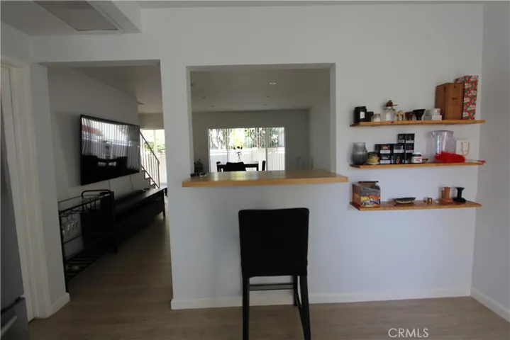 Unit C-  Kitchen looking into living room w/ breakfast bar & room for a small dining set in the kitchen