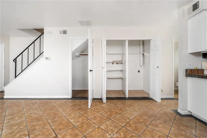 2 storage closets (one under the stairwell and one that serves as a pantry)