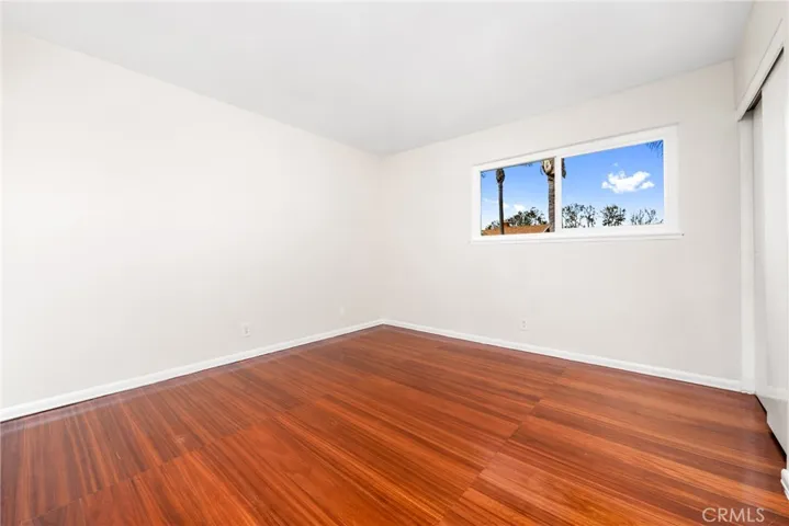 The owner's suite and the secondary bedroom have laminate floors, good sized closets and scraped ceilings!