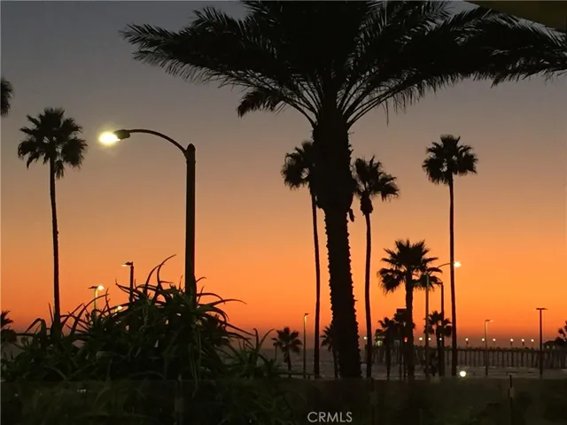 Enjoy SoCal sunsets from the sand or HB pier!