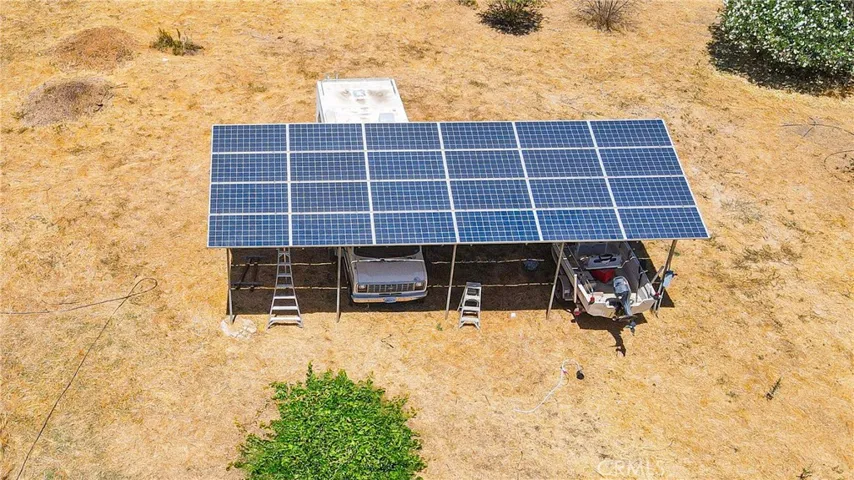 Owner fully, Solar Barn, allows parking under them.